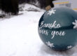 Bansko loves you Christmas ornament overlooking winter mountain landscape