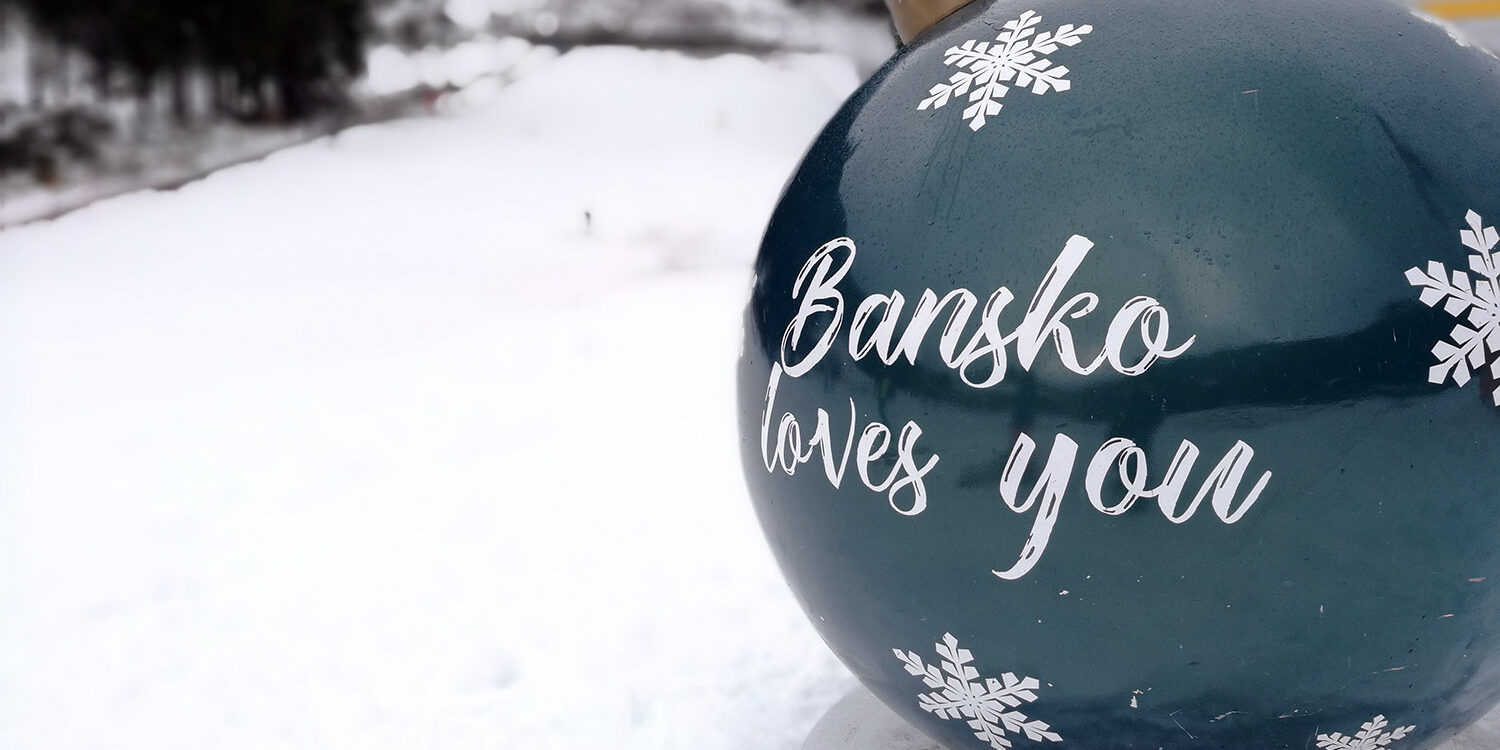 bansko-winter-resort Bansko loves you Christmas ornament overlooking winter mountain landscape