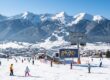 Overview of skiers on snow slopes and lift at Bansko ski resort